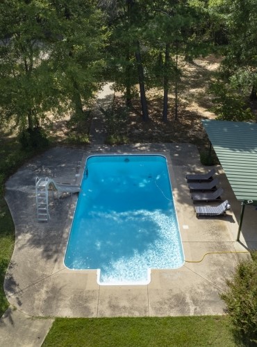 Pool with slide at Ananda Hideway in Broken Bow